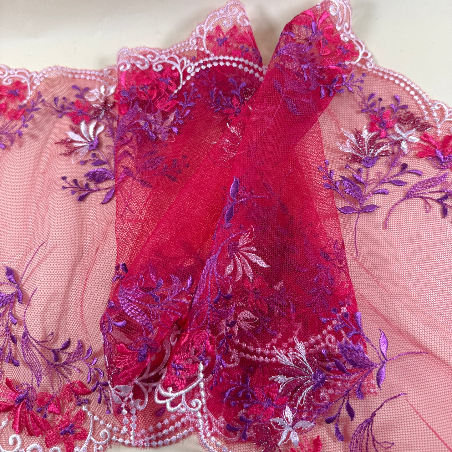 ed galloon lace with red flowers, purple leaves and white embroidery at the edges
