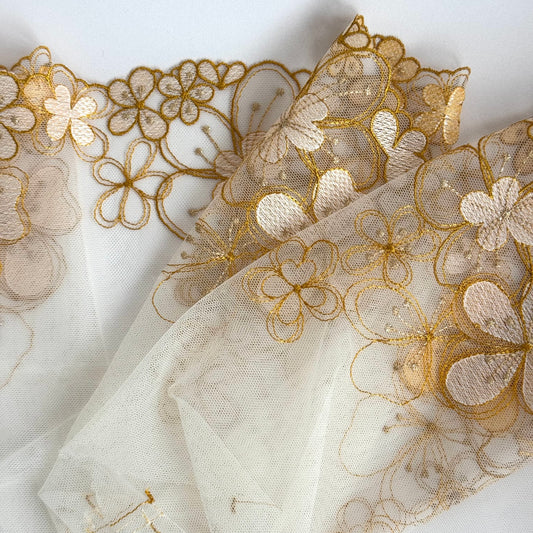 Golden light embroidered tulle lace