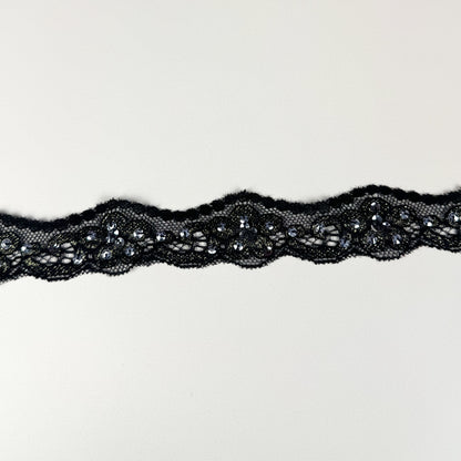 Black lace trim on a light background